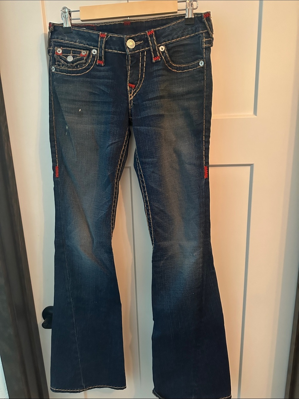 True Religion Dark Blue Flare Jeans with Red and Tan Colored Stitch Accents